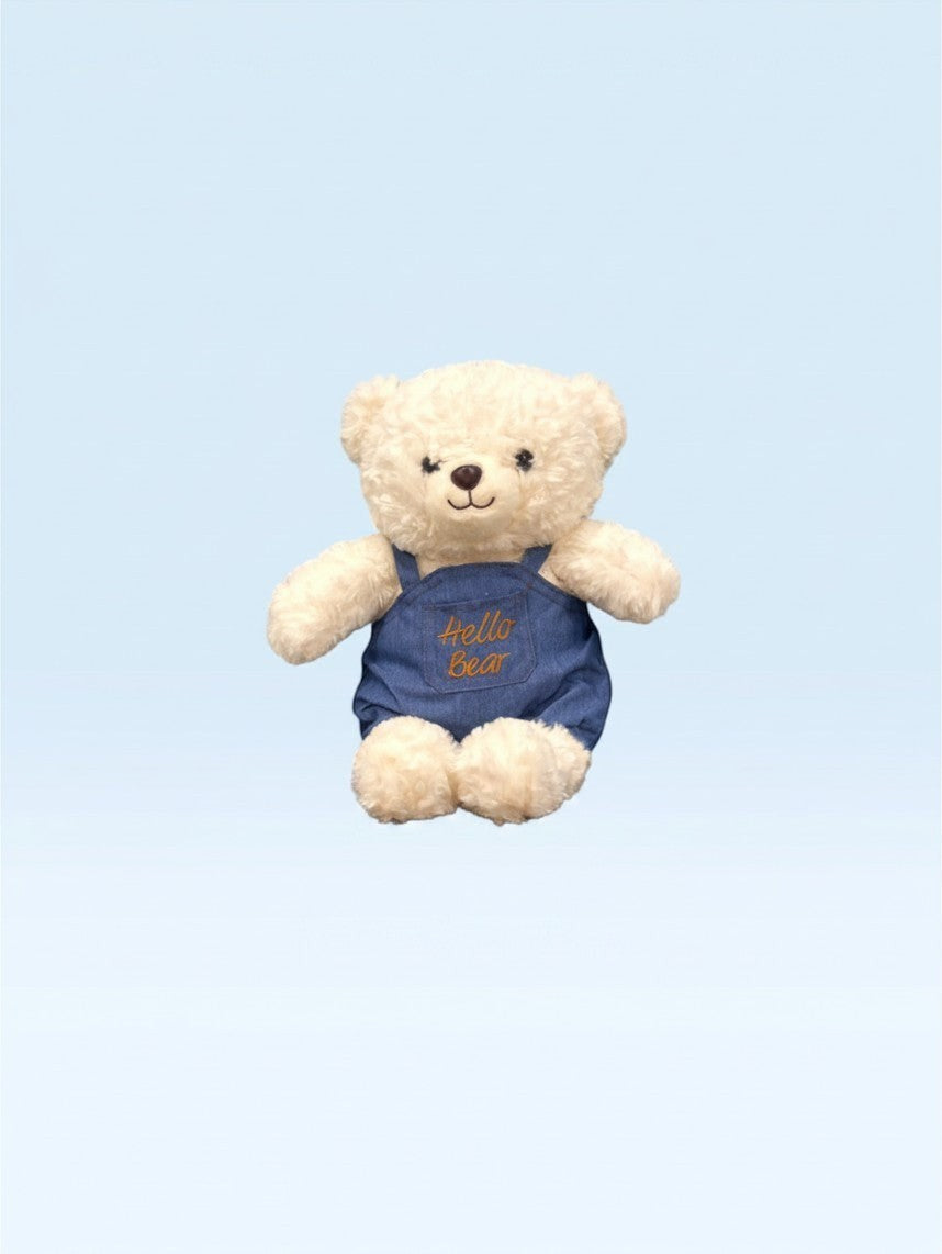 دب محشو ناعم من TagerlSaada بفرو كريمي ووزرة جينز زرقاء مطرزة بعبارة Hello Bear، مثالي كهدية للأطفال.